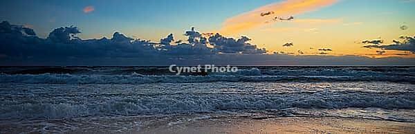Sea coastline with waves. Baltic sea against dramatic cloudy sky at sunset. Panoramic nature landscape [IBR124497496]