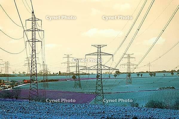 Electricity pylons conducting current from distribution power station, blackout and grid stability concept, copy space [IBR124525407]
