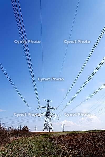 Electricity pylons conducting current from distribution power station, blackout and grid stability concept, copy space [IBR124525416]