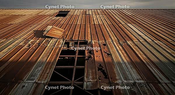 Rusted metal roof with decay and structural damage, construction materials failure concept, AI generated [IBR124550743]
