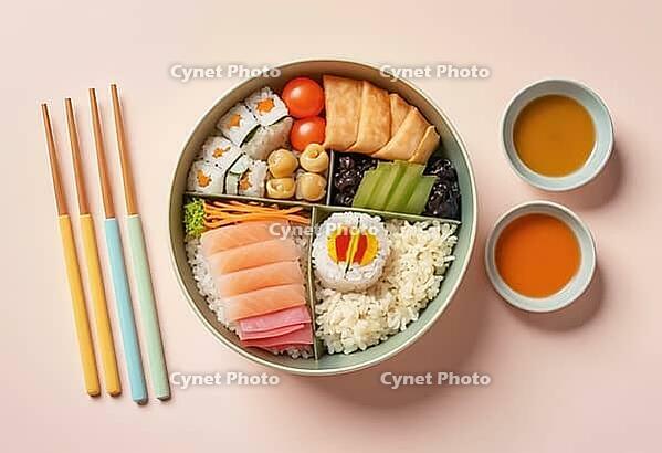 A vibrant and appetizing bento box filled with assorted Japanese delicacies, including fresh salmon sashimi, maki rolls, and fluffy rice, served with dipping sauces, AI generated [IBR124550814]