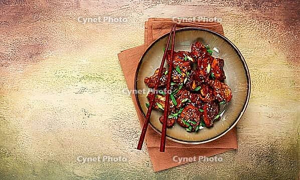 Yakitori chicken kebab, on a plate, with green onions and sesame seeds, top view, no people [IBR124552218]