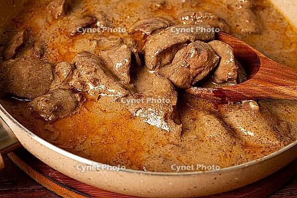 Beef stroganoff, pan cooking, close-up, homemade [IBR124552223]
