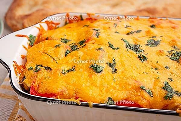Madame Bovary's Georgian dish, chicken fillet with mushrooms, tomatoes and cheese, baked in a mold [IBR124552239]