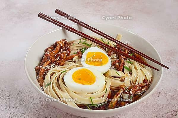 Buckwheat noodles soba with shimeji mushrooms, with boiled egg, green onion, sesame seeds, homemade, without people [IBR124552243]