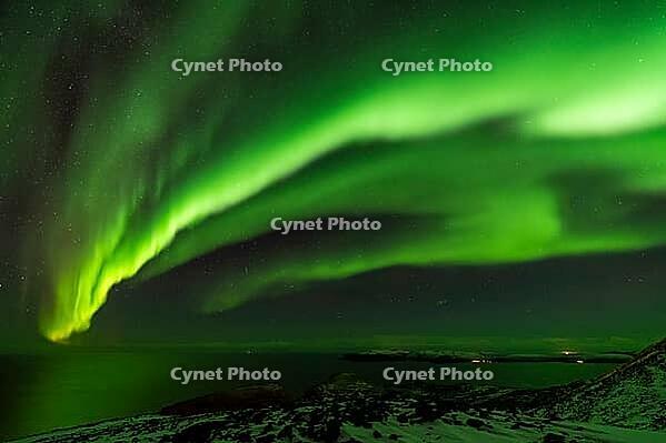 Northern Lights (Aurora borealis) over the Norwegian Sea, S$00F6r$00F6ya, Finnmark, Norway, December 2018 [IBR124563522]
