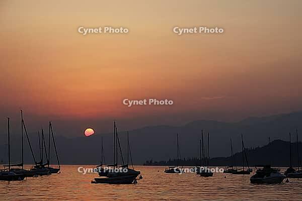On the Bardolino waterfront, Lake Garda in the evening, Italy - At the promenade of Bardolino, Lake Garda in Italy in the evening [IBR124585247]