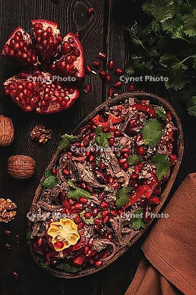 Georgian salad Tbilisi, boiled beef, with red beans and onions, sweet pepper, walnut and pomegranate, homemade, no people [IBR124585346]