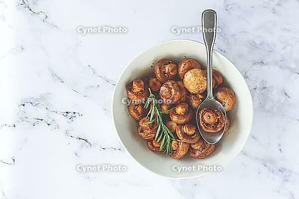 Fried mushrooms, with spices, in soy sauce, vegetarian food, homemade, no people [IBR124585348]