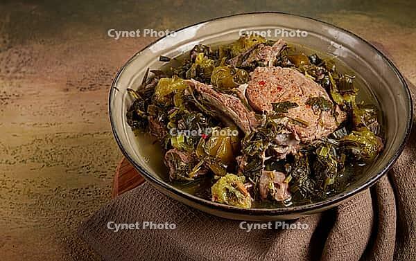 Chakapuli, Georgian dish, stewed meat with herbs and tkemali, in white wine, homemade, no people [IBR124585350]