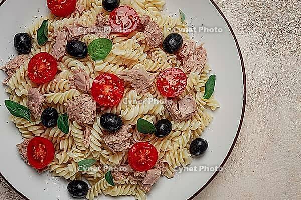 Tuna salad, fusilli pasta, olives and cherry, olive oil, homemade [IBR124585376]