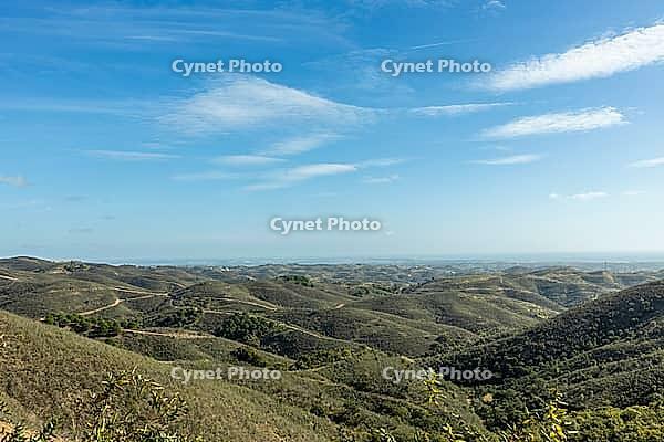 Stunning panoramic view from Miradouro de Vale Covo in Algarve, Portugal, overlooking rugged cliffs, golden beaches, and the turquoise Atlantic Ocean. A perfect scene capturing the natural beauty of southern Portugal's coastline [IBR124586570]