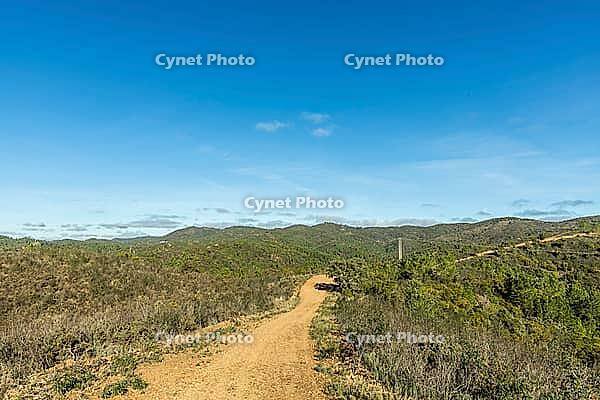 Scenic walking trails winding through the natural landscape of Fonte Férrea in São Brás de Alportel, Algarve, Portugal, offering a peaceful setting for outdoor trips, hiking, and nature exploration [IBR124586598]