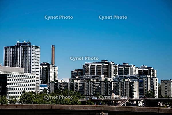 Helsinki, Finland - June 21, 2015 - Urban skyline with modern high-rise buildings and clear blue sky [IBR124626836]