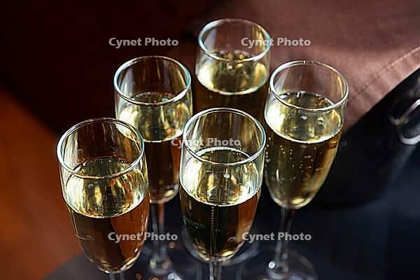 Five elegant champagne glasses filled with sparkling wine, capturing the essence of a joyful celebration. perfect for festive gatherings and special occasions [IBR124626871]