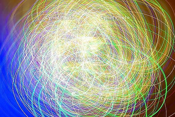 Dynamic and colorful light trails create a captivating abstract pattern. this lively composition features swirling lines in a spectrum of colors, evoking motion and energy [IBR124626893]