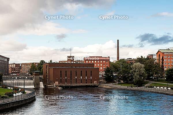 Tampere, Finland - August 29, 2014 - Scenic urban river view with historic brick buildings [IBR124626905]