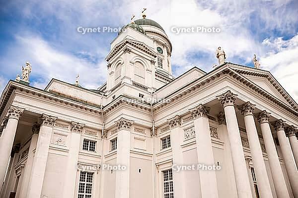 Helsinki, Finland - August 28, 2014 - Iconic white cathedral with columns and statues against blue sky in helsinki [IBR124626907]