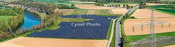 Open-space photovoltaic system, solar park in Talheim am Neckar. high voltage line. aerial view. Baden-W$00FCrttemberg, Germany [IBR124629478]
