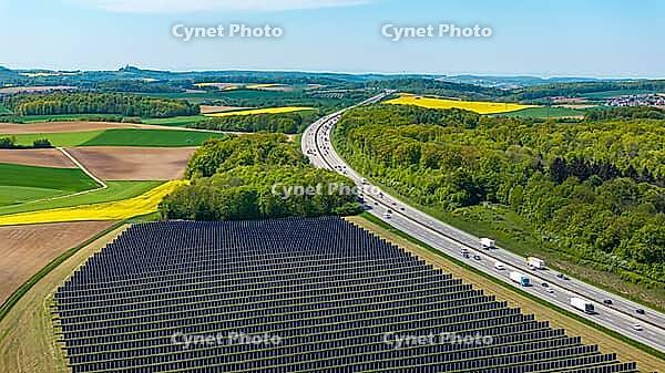 Open-space photovoltaic system, solar park near Bad Rappenau. B$00FCrger.Energie Agri PV system. Vertical solar panels on the motorway. Bad Rappenau, Baden-W$00FCrttemberg, Germany [IBR124629479]