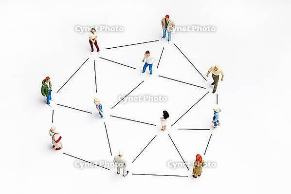 People miniature figurines connected, as concept for social networking [IBR124629569]
