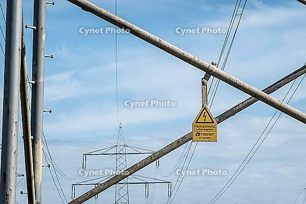 High voltage warning sign on power pole, overhead line, energy infrastructure, Hoya, Lower Saxony, Germany [IBR124631254]