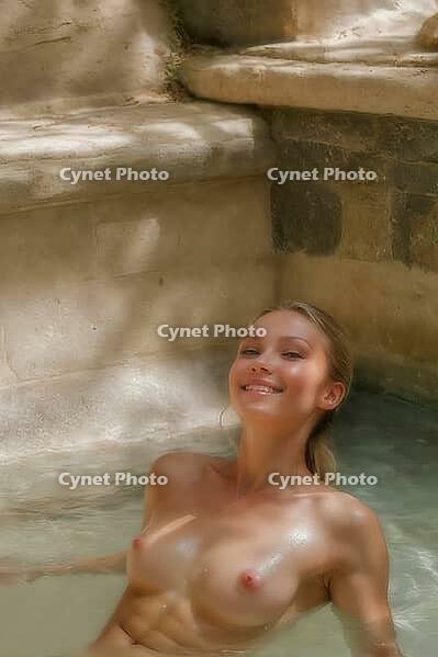 Blonde woman sitting in an old natural stone and rock pool, spa, wellness, relaxation, pool, natural pond, outdoor, nude photo, nude photo, nude photography, naked, naked, naked, slim, sexy, erotic, health, water treatment, bathing, spa, body care, oasis, [IBR124642050]