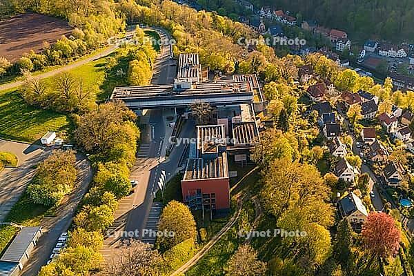 Aerial view of a building complex with roads and trees in an autumnal village environment, Calw District Office, Calw District, Germany [IBR124642837]