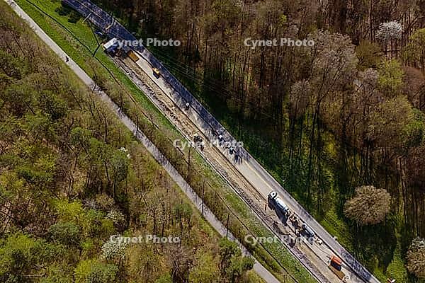 Road under construction near a dense forest area, construction of bicycle path, Aidlingen, Böblingen district, Germany [IBR124642855]