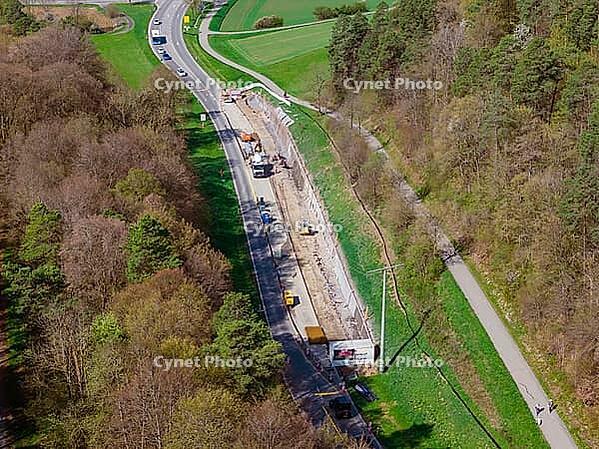 Road construction through wooded rural area, construction of bicycle path, Aidlingen, Böblingen district, Germany [IBR124642856]