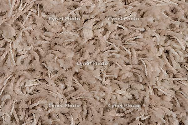 Closeup detail of beige carpet texture background [IBR124676064]