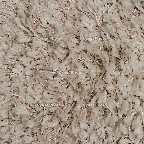 Closeup detail of beige carpet texture background [IBR124676065]