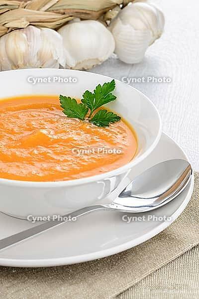 Pumpkin soup on white wood background [IBR124676077]