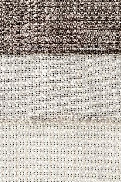 Closeup detail of beige fabric texture background [IBR124676096]