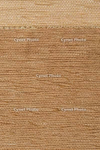 Closeup detail of brown fabric texture as background [IBR124676119]