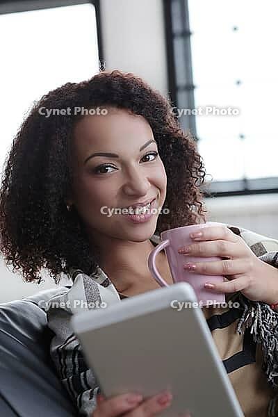 Lifestyle. Beautiful woman at home [IBR124724837]