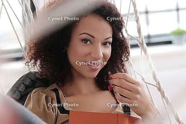 Lifestyle. Beautiful woman at home [IBR124724838]