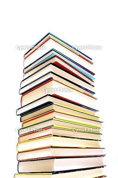 Stack of books against a white background [IBR124748900]