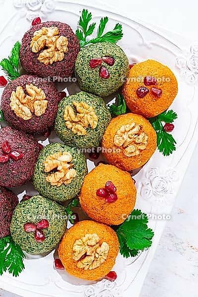Assortment of Pkhali, pumpkin, spinach and beetroot, Georgian dish, on a white plate, appetizer with nuts and spices, no people, homemade [IBR124748957]