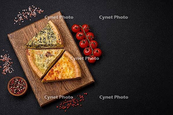Food, Delicious quiche with broccoli, chicken or salmon and cheese with salt and spices on a dark concrete background [IBR124773760]