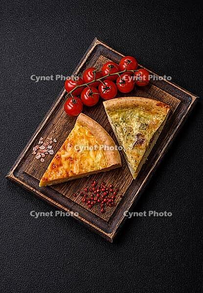 Food, Delicious quiche with broccoli, chicken or salmon and cheese with salt and spices on a dark concrete background [IBR124773763]