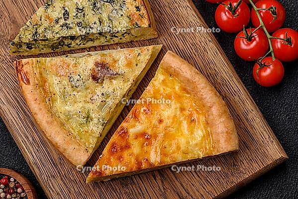 Food, Delicious quiche with broccoli, chicken or salmon and cheese with salt and spices on a dark concrete background [IBR124773770]