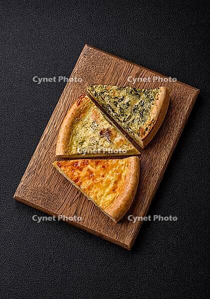 Food, Delicious quiche with broccoli, chicken or salmon and cheese with salt and spices on a dark concrete background [IBR124773771]