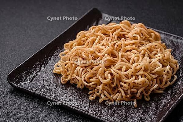 Food, Asian dish rice noodles with salt and spices on dark concrete background [IBR124773778]