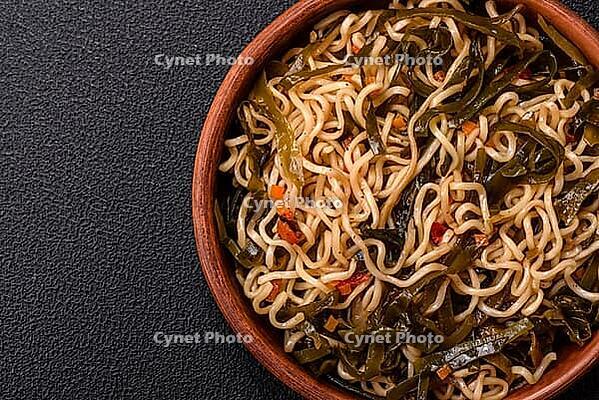 Food, Asian dish rice noodles with salt and spices on dark concrete background [IBR124773780]
