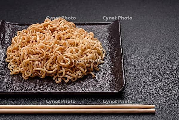 Food, Asian dish rice noodles with salt and spices on dark concrete background [IBR124773787]