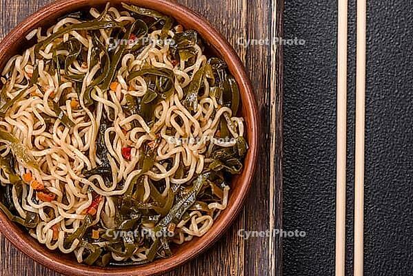 Food, Asian dish rice noodles with salt and spices on dark concrete background [IBR124773789]