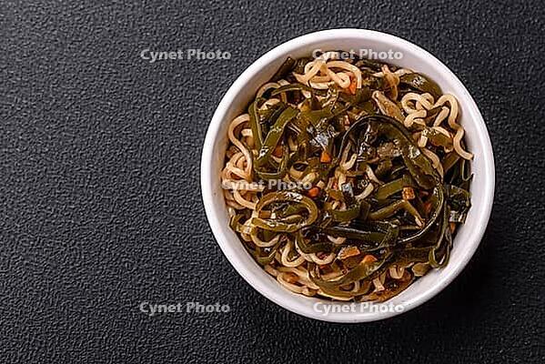 Food, Asian dish rice noodles with salt and spices on dark concrete background [IBR124773791]