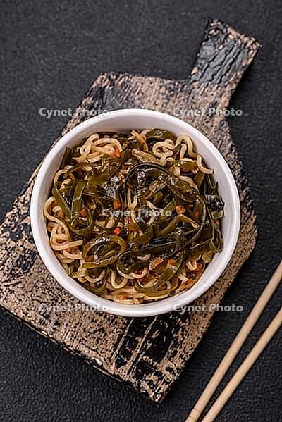 Food, Asian dish rice noodles with salt and spices on dark concrete background [IBR124773800]