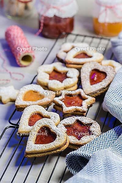 Homebaked Christmas Cookies With fruit Jam filling and Icing Sugar [IBR124817840]